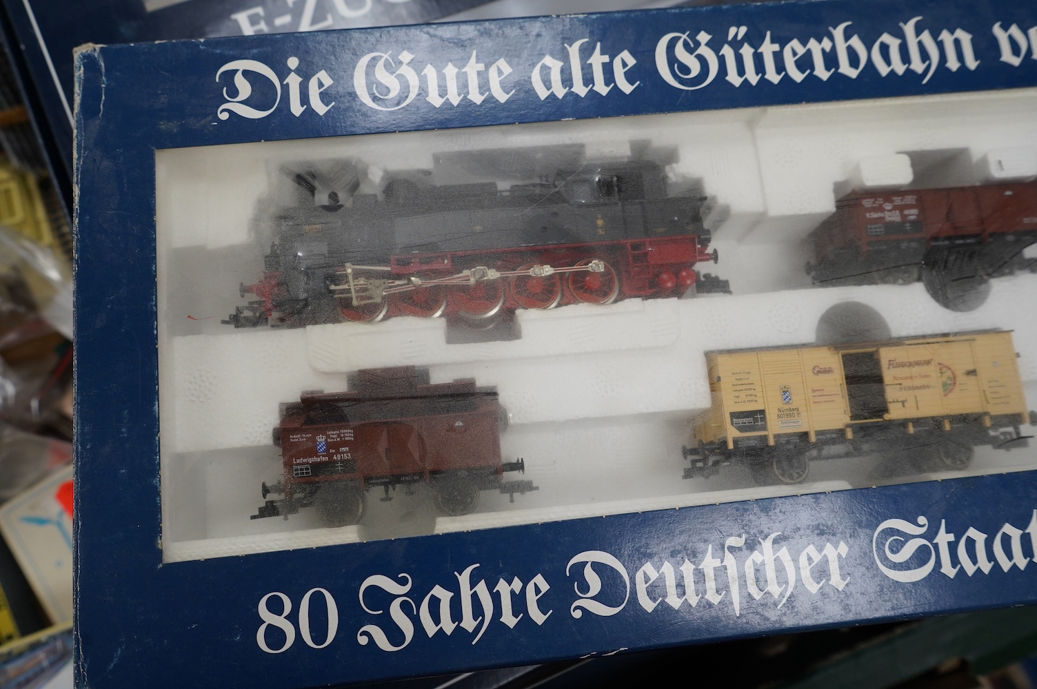 Three boxed Fleischmann HO gauge railway train sets; a passenger set with a 4-6-4T Loco and three clerestory coaches (4887), and two goods train sets, both comprising of a locomotive and an assortment of freight wagons (